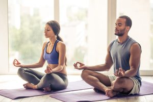 Beautiful,Afro,American,Couple,In,Sports,Clothes,Is,Meditating,Sitting